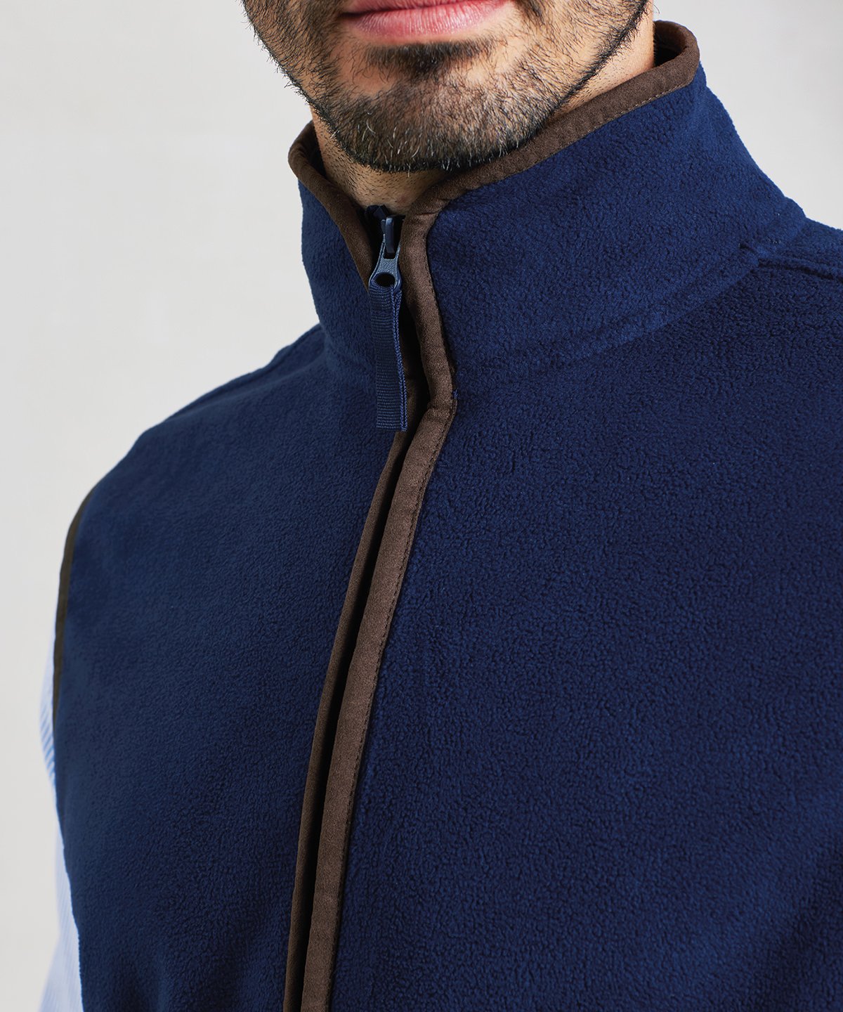 Detail view of the PR803 artisan gilet showing the two-way zip and contrast trim on the collar