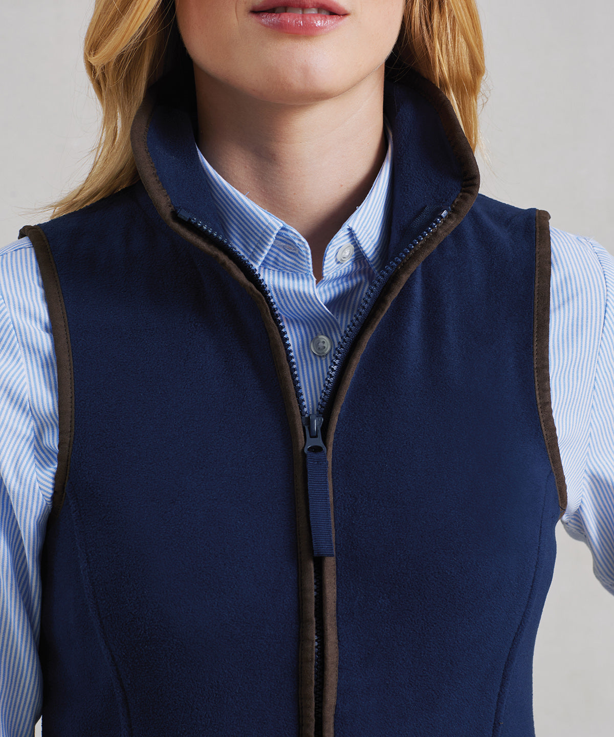 Close-up of the PR803 Artisan fleece gilet front collar showing the contrast trim detail and the top of the two-way zip.