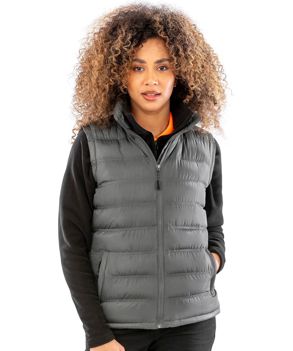 Female model wearing the R193F Ice Bird puffer gilet, highlighting the lightweight insulation and feminine silhouette in an outdoor setting.