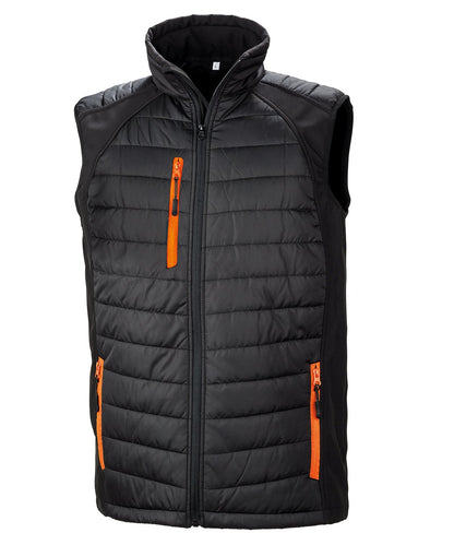 R238X Compass hybrid gilet in Black with Orange zippers showing the quilted padded core and flexible softshell side panels.