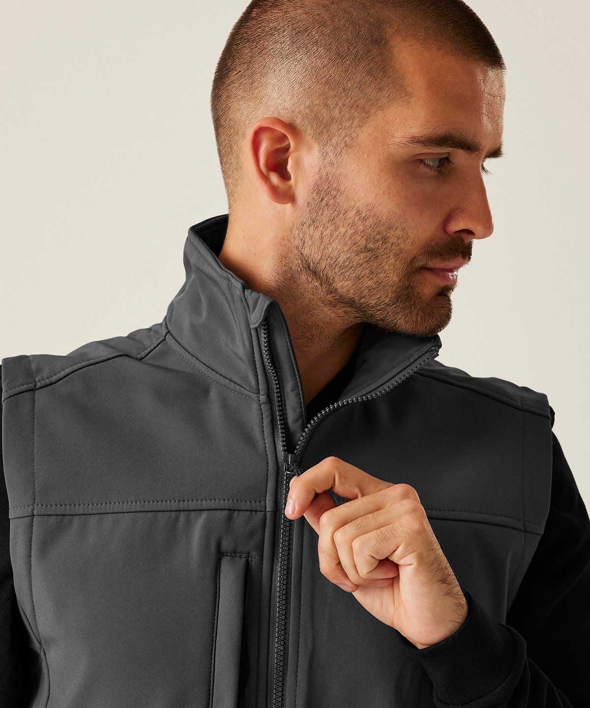 Model wearing the RG154 Flux gilet showing a close up neck zipper