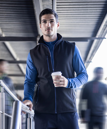 Model wearing the RG595 Navigate softshell vest, highlighting the lightweight design and professional uniform look.
